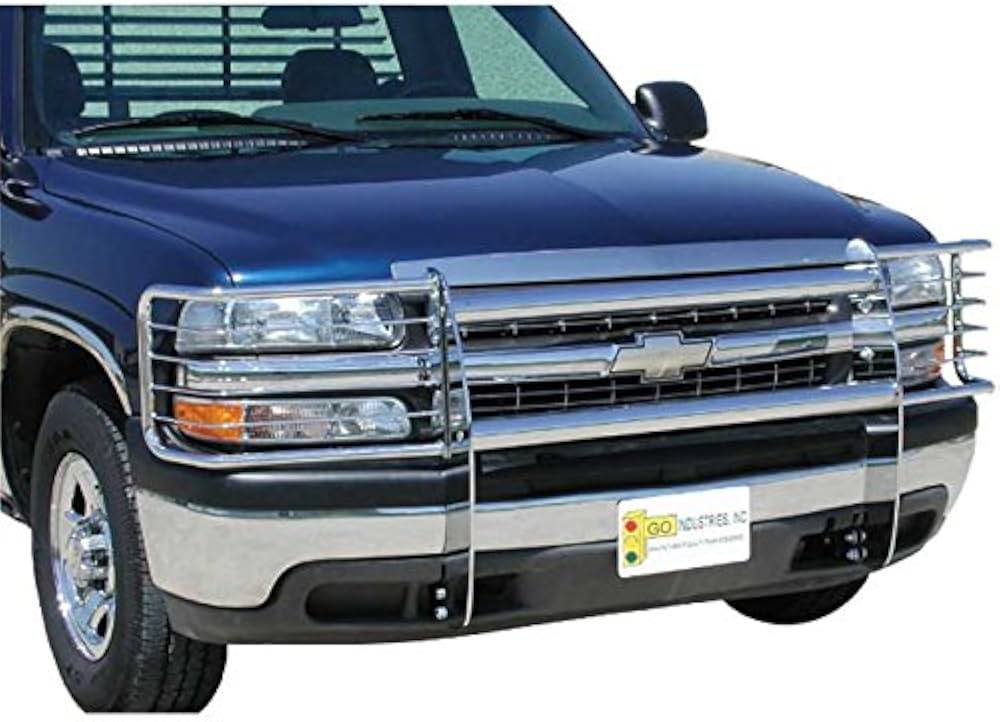 Close-up of a blue Chevrolet truck with a chrome grille guard, showcasing its front features and distinctive styling.
